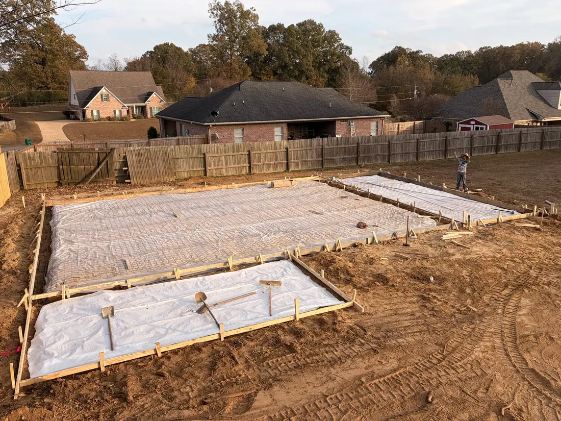 Concrete slab fully formed with vapor barrier and reinforcement in place before the pour