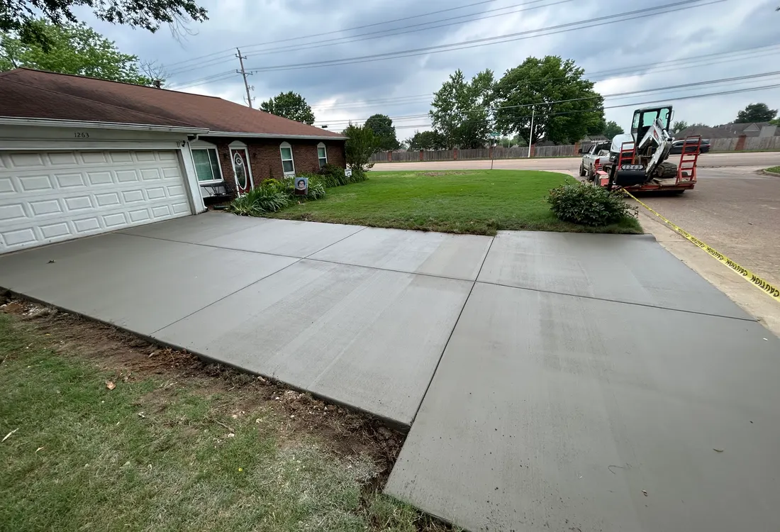 Concrete driveway approaching a garage