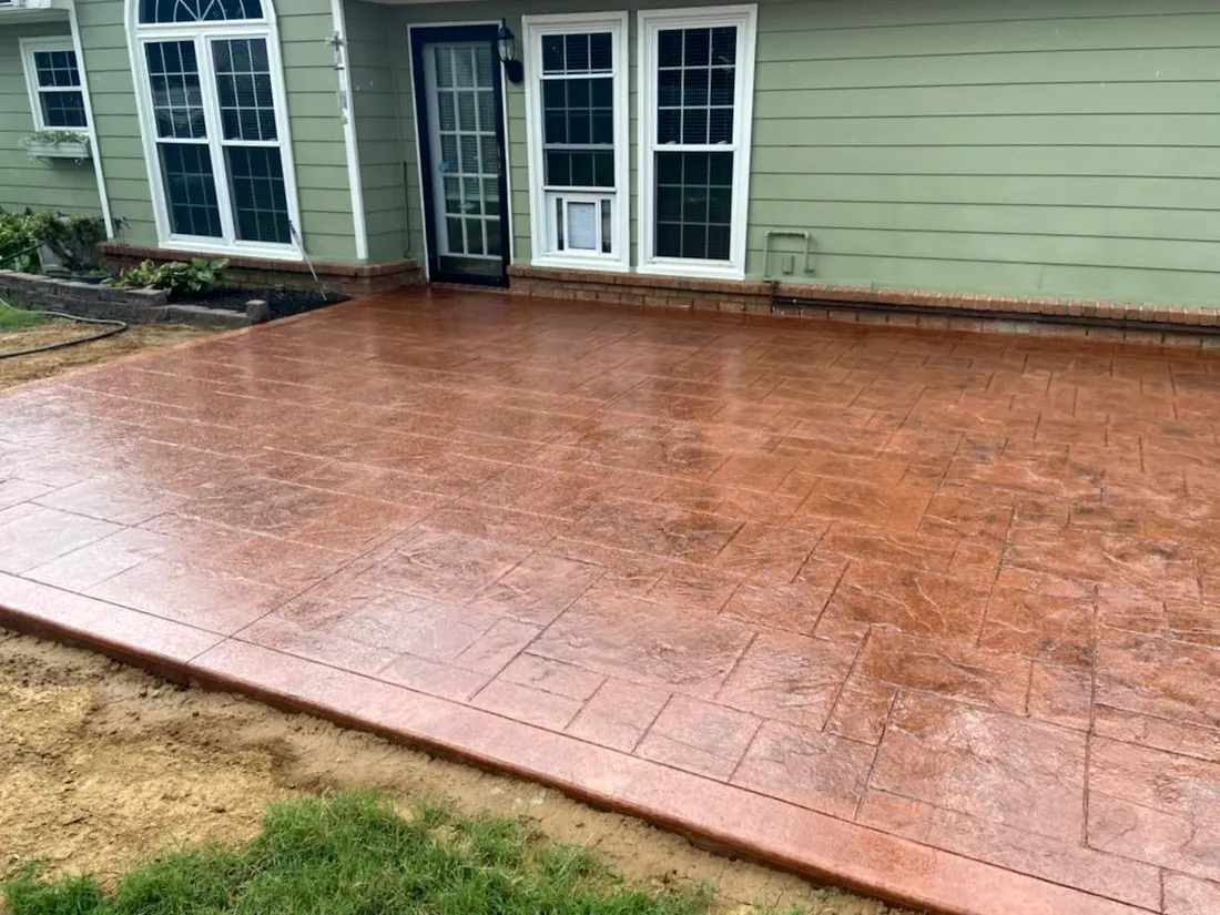 Stamped and stained patio in a warm red tone