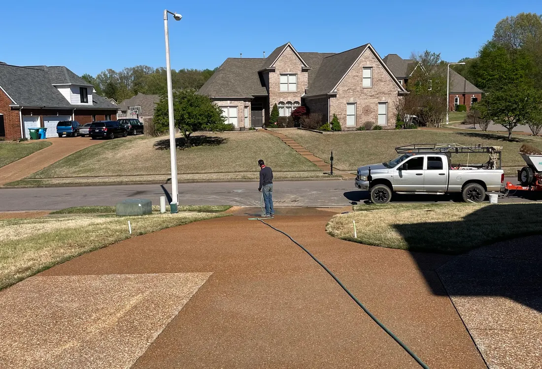 Driveway base graded and compacted with the crew and truck on site
