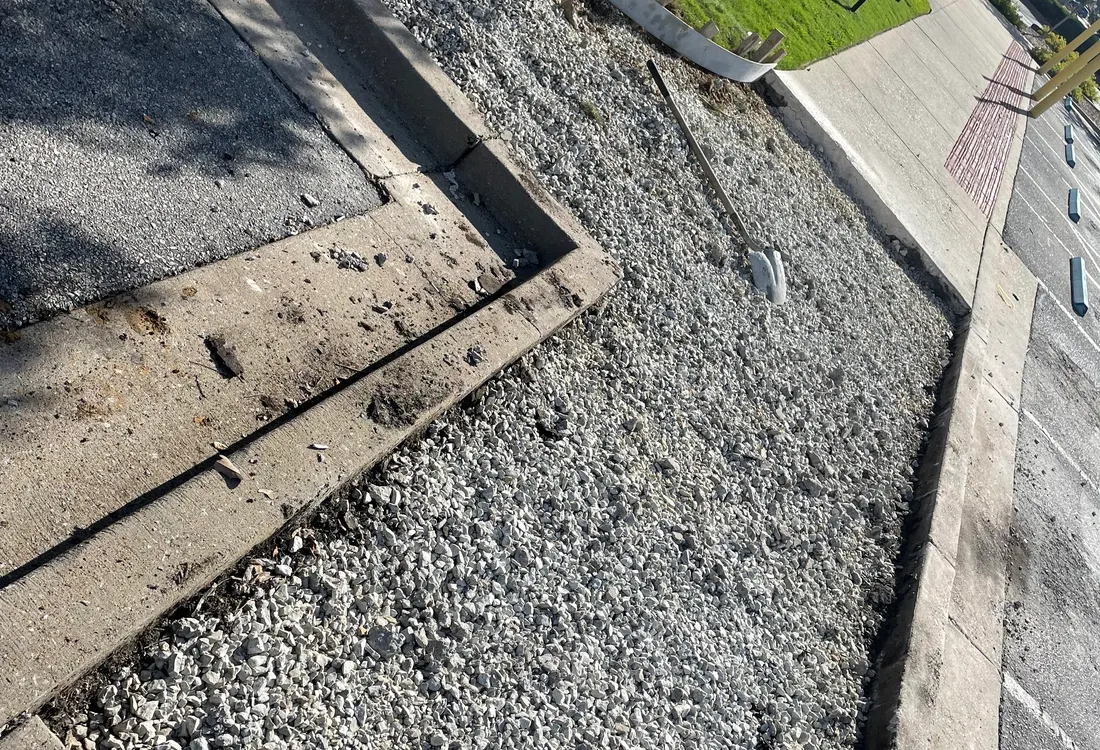 Failed section cut out to a gravel base beside the existing slab