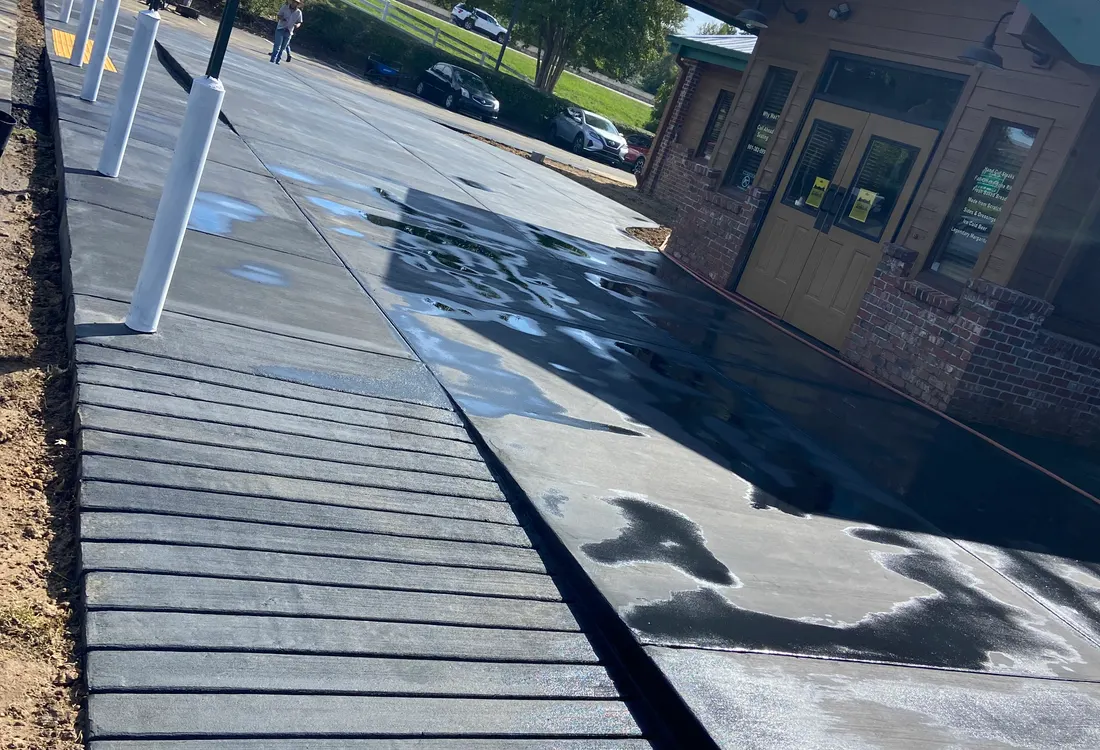 Long dark-finished walkway formed with board edges