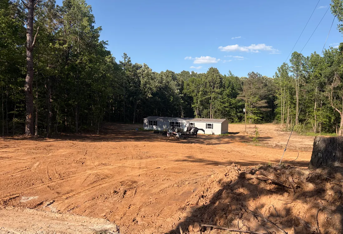 Cleared and graded lot with equipment on site